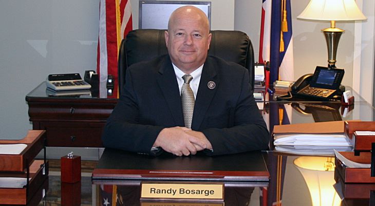 Randy Borsage sitting behind desk