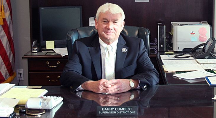 Barry Cumbest sitting behind desk
